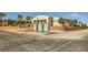 Neighborhood street view showcasing charming single-story home, desert landscaping, and a street mailbox at 440 N Lisbon St, Henderson, NV 89015