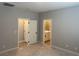 Bedroom with neutral carpeting and access to the closet and ensuite bathroom at 4409 Pioche Ave, North Las Vegas, NV 89032