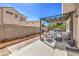 Backyard patio features ample space and a covered seating area, perfect for outdoor relaxation and entertaining at 4514 Calico Cliff Ct, North Las Vegas, NV 89031