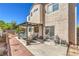 This backyard patio features a covered seating area and sliding door access to the home's interior at 4514 Calico Cliff Ct, North Las Vegas, NV 89031