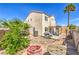 The backyard features a mix of patio space, landscaping, a grill, and a trampoline at 4514 Calico Cliff Ct, North Las Vegas, NV 89031