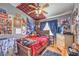 This cozy bedroom features a wood frame bed, colorful decor and posters, and a comfortable atmosphere at 4514 Calico Cliff Ct, North Las Vegas, NV 89031