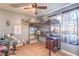 Bedroom features a ceiling fan, carpet flooring, and a lofted bed with desk area at 4514 Calico Cliff Ct, North Las Vegas, NV 89031