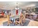 Inviting dining area with tile floors, a decorative chandelier, and easy access to the kitchen and living area at 4514 Calico Cliff Ct, North Las Vegas, NV 89031