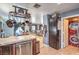 Bright kitchen with a pot rack, stainless steel dishwasher, and an adjacent dining and laundry area at 4514 Calico Cliff Ct, North Las Vegas, NV 89031