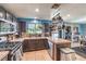 Spacious kitchen with stainless steel appliances, ample countertop space, and easy access to the dining area at 4514 Calico Cliff Ct, North Las Vegas, NV 89031