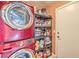 The laundry room features a red washer/dryer unit and shelving with household supplies at 4514 Calico Cliff Ct, North Las Vegas, NV 89031