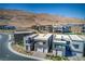 Modern homes with desert landscaping, mountain views, and private driveways in a Primary-planned community at 5429 Succulent Rose Dr, Las Vegas, NV 89135