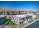 View of modern homes featuring desert landscaping, attached garages, and mountain views in a modern neighborhood at 5429 Succulent Rose Dr, Las Vegas, NV 89135