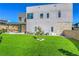 Expansive backyard featuring artificial turf, creating a lush and inviting outdoor space for recreation and relaxation at 5429 Succulent Rose Dr, Las Vegas, NV 89135