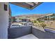 Balcony view showcasing modern homes and desert landscape on a sunny day at 5429 Succulent Rose Dr, Las Vegas, NV 89135