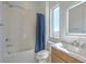 Modern bathroom with shower-tub combo, vanity, and bright lighting at 5429 Succulent Rose Dr, Las Vegas, NV 89135