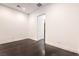 Clean white bedroom with hardwood floors and a view of a walk in closet at 5429 Succulent Rose Dr, Las Vegas, NV 89135