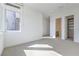 Unfurnished bedroom featuring an adjacent bathroom and walk-in closet at 5429 Succulent Rose Dr, Las Vegas, NV 89135