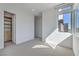Unfurnished bedroom featuring a walk-in closet and natural light at 5429 Succulent Rose Dr, Las Vegas, NV 89135