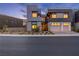 Modern home with a two-car garage and manicured front yard at 5429 Succulent Rose Dr, Las Vegas, NV 89135