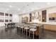 Modern, spacious kitchen with large island, stainless steel appliances, and dark wood flooring at 5429 Succulent Rose Dr, Las Vegas, NV 89135