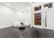 Modern sitting room with hardwood floors, high ceilings, and ample natural light at 5429 Succulent Rose Dr, Las Vegas, NV 89135