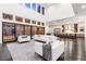 Bright, open living room boasts high ceilings, modern furniture, and seamless indoor-outdoor flow with a view of the backyard pool at 5429 Succulent Rose Dr, Las Vegas, NV 89135