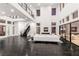 Grand living room with soaring ceilings, fireplace, and seamless access to outdoor areas through expansive glass doors at 5429 Succulent Rose Dr, Las Vegas, NV 89135