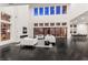 Spacious living area with soaring ceilings, a cozy fireplace, and expansive windows providing abundant natural light at 5429 Succulent Rose Dr, Las Vegas, NV 89135