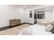 Bright main bedroom with a sitting area, large windows, and neutral decor at 5429 Succulent Rose Dr, Las Vegas, NV 89135