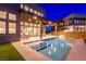 Inviting backyard pool with sleek design, surrounded by a patio and lush landscaping, perfect for relaxation and entertainment at 5429 Succulent Rose Dr, Las Vegas, NV 89135