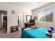 Bedroom featuring natural light from a window with a comfortable bed and soft furnishings at 5633 Alitak Bay St, North Las Vegas, NV 89081