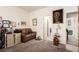 Bedroom featuring a cozy seating area with a comfortable sofa, perfect for reading or relaxing at 5633 Alitak Bay St, North Las Vegas, NV 89081