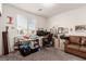 Bedroom featuring a window and a sofa, offering a versatile space for relaxation and natural light at 5633 Alitak Bay St, North Las Vegas, NV 89081