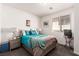 Bright bedroom featuring a queen bed, window, and side tables with lamps for a warm and inviting atmosphere at 5633 Alitak Bay St, North Las Vegas, NV 89081
