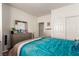 Bright bedroom featuring a queen bed, dresser, and windows for a calm and peaceful atmosphere at 5633 Alitak Bay St, North Las Vegas, NV 89081