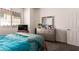 Bright bedroom featuring a queen bed, dresser, and windows for a calm and peaceful atmosphere at 5633 Alitak Bay St, North Las Vegas, NV 89081