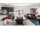 Dining area is connected to the kitchen, featuring seating for six, bright windows, and modern decor at 5633 Alitak Bay St, North Las Vegas, NV 89081
