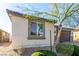 Charming single-story home showcasing a well-manicured lawn and a two-car garage, complete with stone accents and desert landscaping at 5633 Alitak Bay St, North Las Vegas, NV 89081