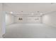 Large finished basement with carpet, recessed lighting, and three small windows at 5741 S Pearl St, Las Vegas, NV 89120