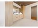 Bright bathroom with dual sinks, wood-look cabinets, tile floor, and ample counter space at 5741 S Pearl St, Las Vegas, NV 89120