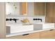 Modern bathroom with dual square vessel sinks, matte black faucets, and stylish wood cabinetry at 5741 S Pearl St, Las Vegas, NV 89120