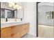 Modern bathroom featuring double sinks and a clear view into an adjacent bedroom at 5741 S Pearl St, Las Vegas, NV 89120