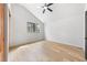 Minimalist bedroom featuring light hardwood floors and a single window at 5741 S Pearl St, Las Vegas, NV 89120