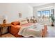 Bright bedroom featuring an inviting window seat, neutral walls, and warm, earthy decor at 5741 S Pearl St, Las Vegas, NV 89120