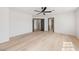 Spacious bedroom with hardwood floors, a ceiling fan, and natural lighting at 5741 S Pearl St, Las Vegas, NV 89120