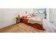 Well-lit bedroom with a comfortable bed, stylish rug, and a cozy window nook at 5741 S Pearl St, Las Vegas, NV 89120