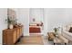Open view of a bedroom features a wood dresser and an arched doorway with a bed at 5741 S Pearl St, Las Vegas, NV 89120