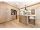 Spacious kitchen with island, bar stool seating, and modern cabinetry at 5741 S Pearl St, Las Vegas, NV 89120