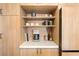 Built-in kitchen shelving with a coffee maker and assorted decor at 5741 S Pearl St, Las Vegas, NV 89120