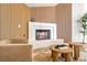Well-appointed living room features a fireplace, wood slat accent wall, modern decor, and comfortable seating at 5741 S Pearl St, Las Vegas, NV 89120