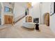 Large living room with vaulted ceilings, modern fireplace, wooden accents, and an open staircase at 5741 S Pearl St, Las Vegas, NV 89120
