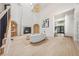 Bright living room with fireplace, vaulted ceilings, modern staircase, and lots of natural light at 5741 S Pearl St, Las Vegas, NV 89120