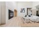 Spacious living room with fireplace and a large artwork piece hanging on the wall at 5741 S Pearl St, Las Vegas, NV 89120